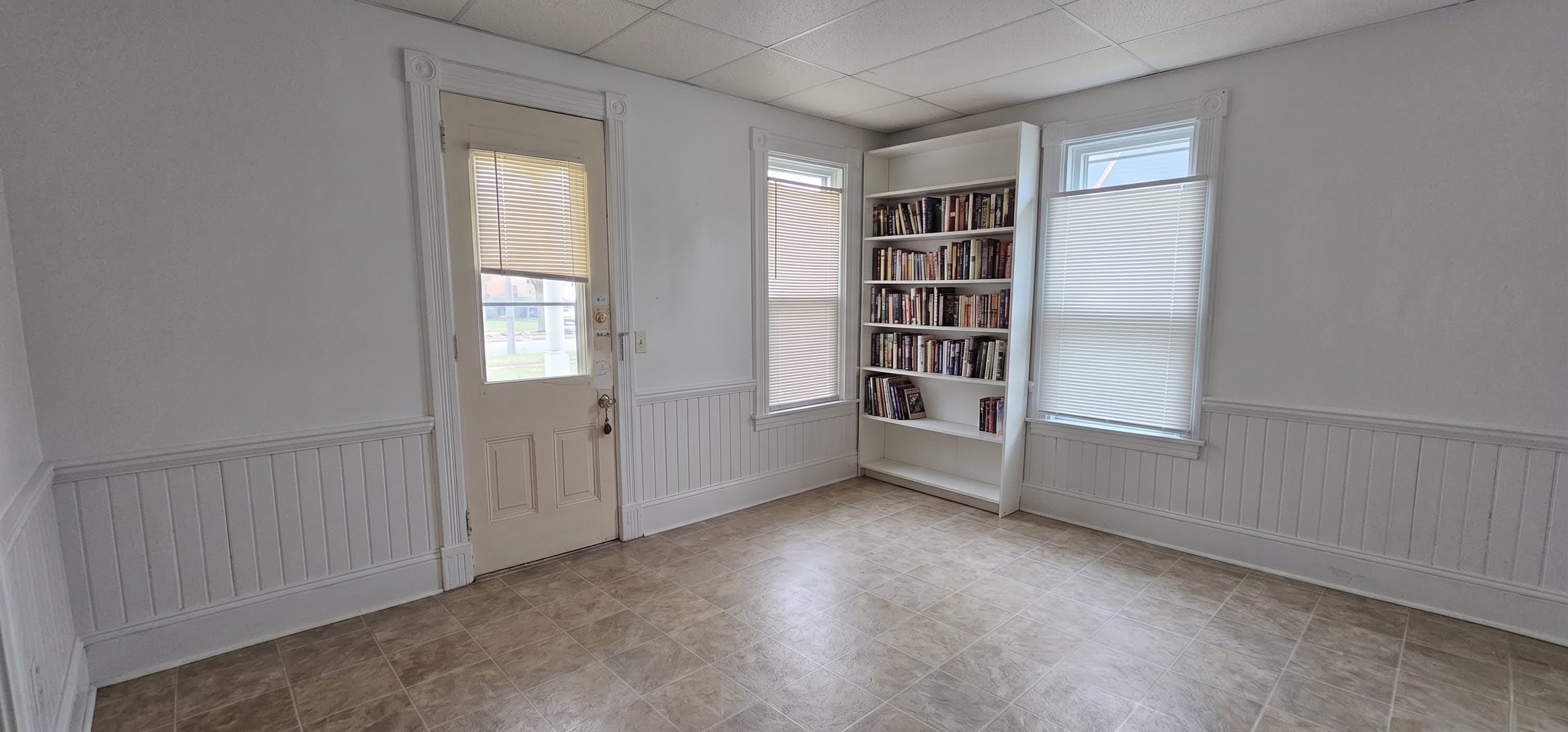 306 Unit 2 Living Room — bright living area with built-in bookshelf